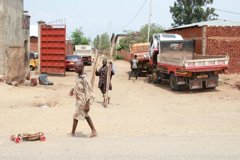 © alexandra buxbaum - A child plays with a makeshift toy car in the Kanyosha neighborhood of Bujumbura.