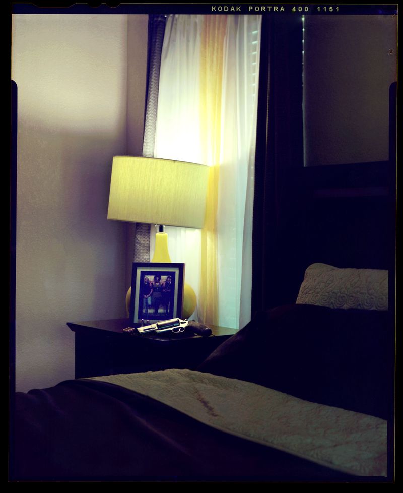 © Christian K. Lee - A firearm rests near the owners bed for protection.