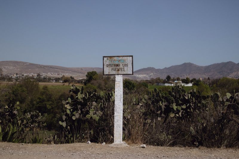 © Sandra Loza - My mom wrote about  how two strong pillars were needed to build a strong bridge. The sign reads “destroy the bridges”