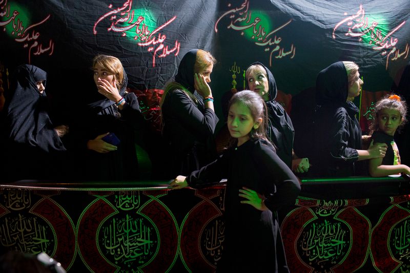 © Mojgan Ghanbari - Muslim woman stands at the street and mourns during Ashura ceremony in Tehran, Iran, 2019.