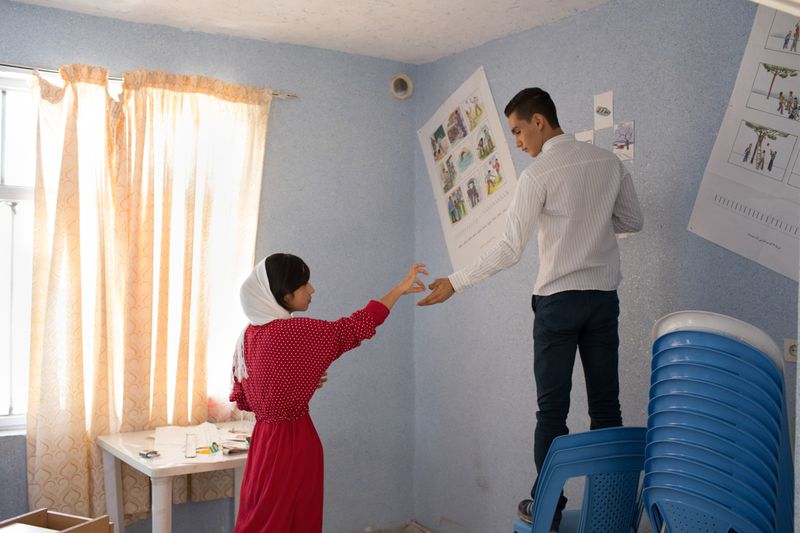 © Mojgan Ghanbari - Teenagers decorating a classroom for an NGO in Tehran, Iran on July, 2014.