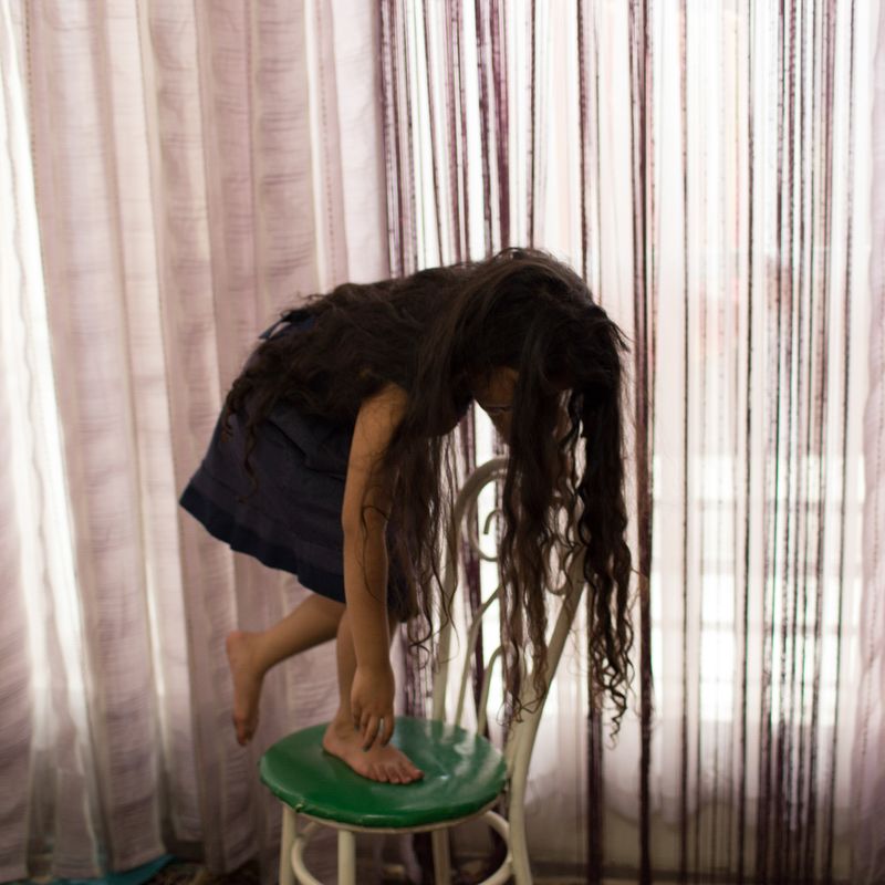 © Mojgan Ghanbari - 8-year-old Hasti playing around in her grandmother's house in Tehran, Iran, 2017.