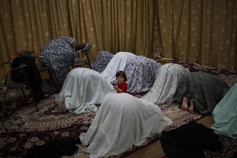 © Mojgan Ghanbari - Women praying at a local mosque in Tehran, Iran on July, 2013.