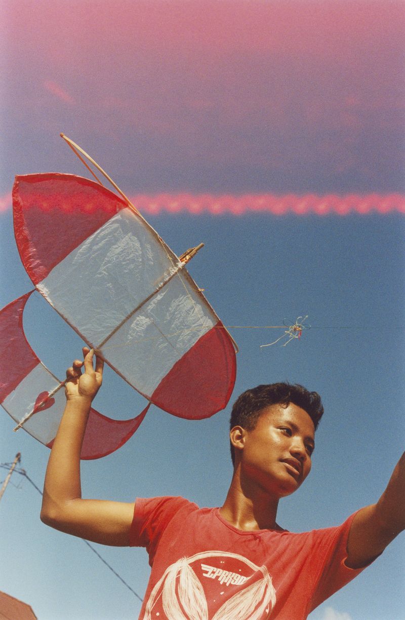 © Farid Renais Ghimas - Haikal in Red Flying a Red and White Kite, 2022