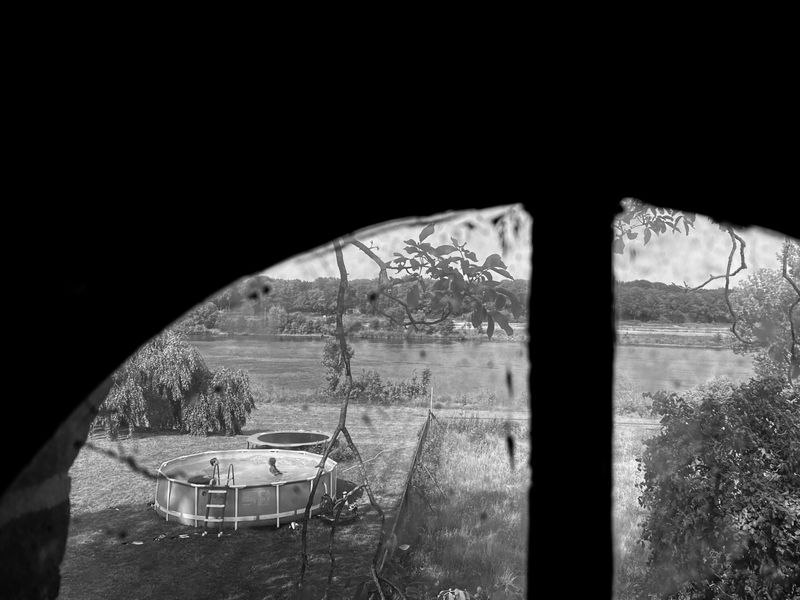 © Julia Zyrina - Through the attic window you see an oval world