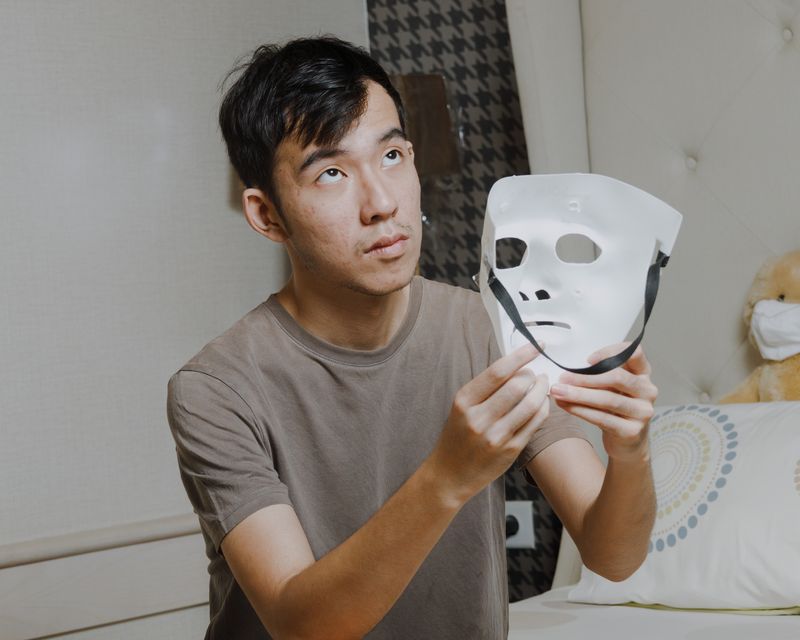 © Andrew Tedy - South Jakarta, 2024. A self-portrait holding the mask used during the making of Outdonesia.