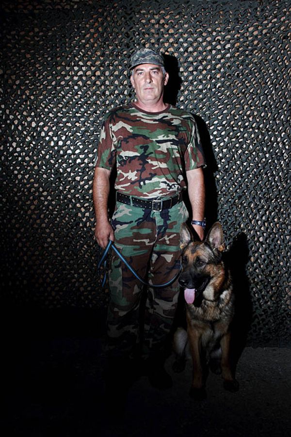 © Yuri Ivashchenko - Cynologist Kutbudin with his dog Volf