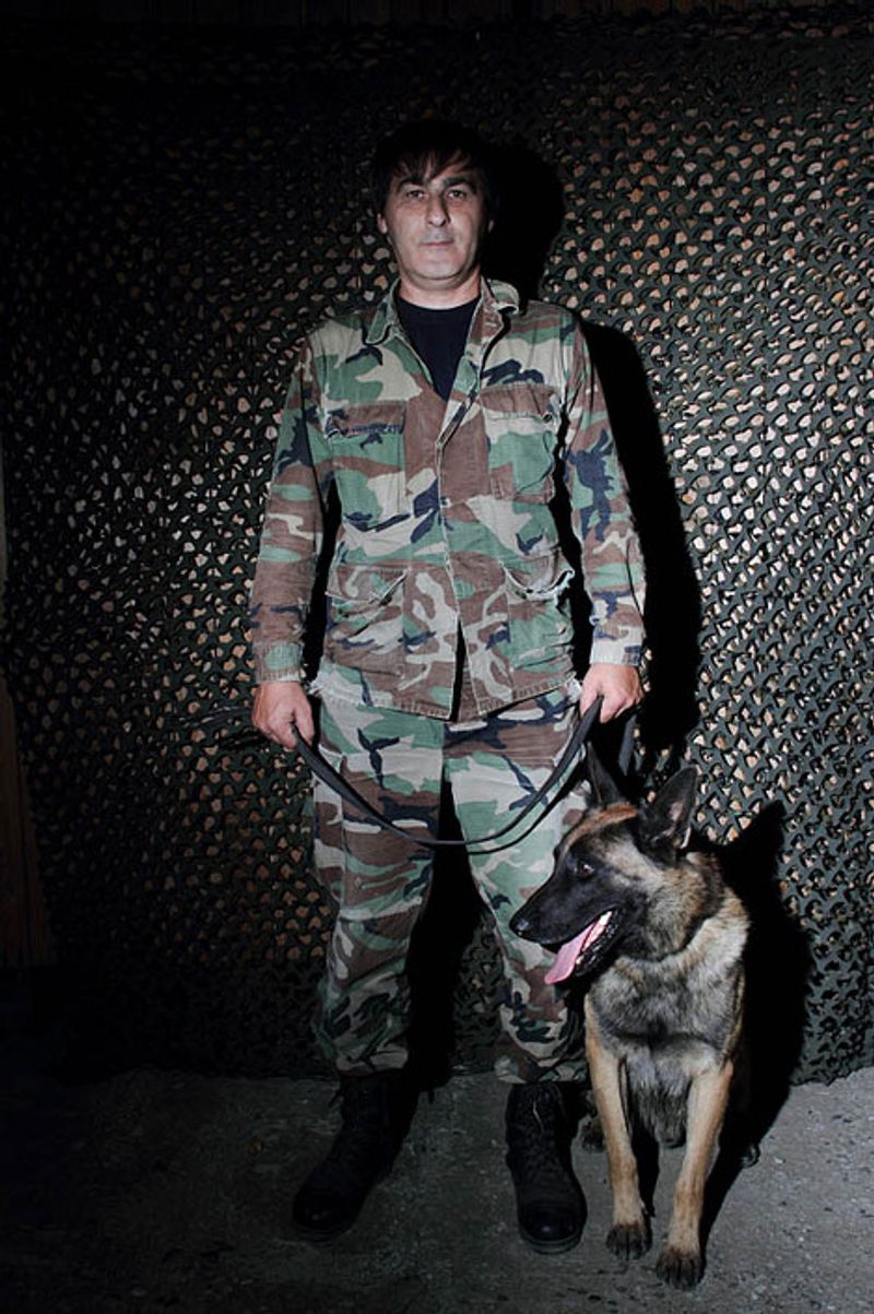 © Yuri Ivashchenko - Cynologist Magomed-Mirza with his dog Gent