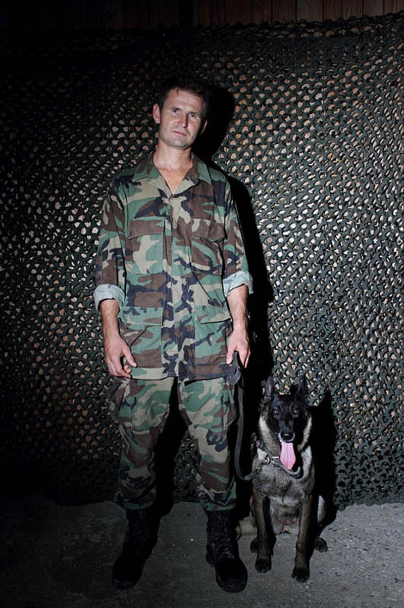 © Yuri Ivashchenko - Cynologist Sergei with his dog Giza