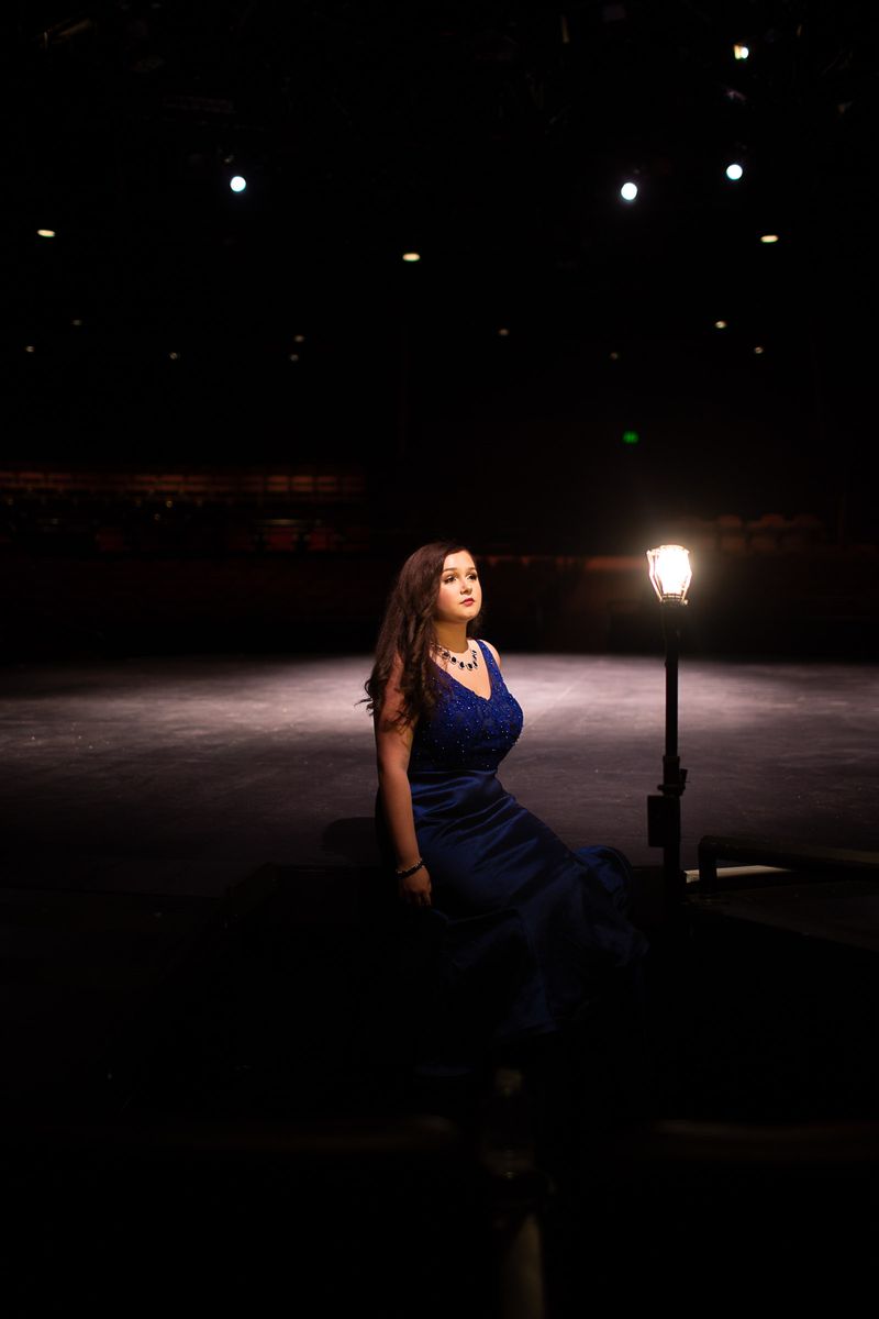 © Lindsay Morris - Theater student, Nicole, poses on her university stage (2021).