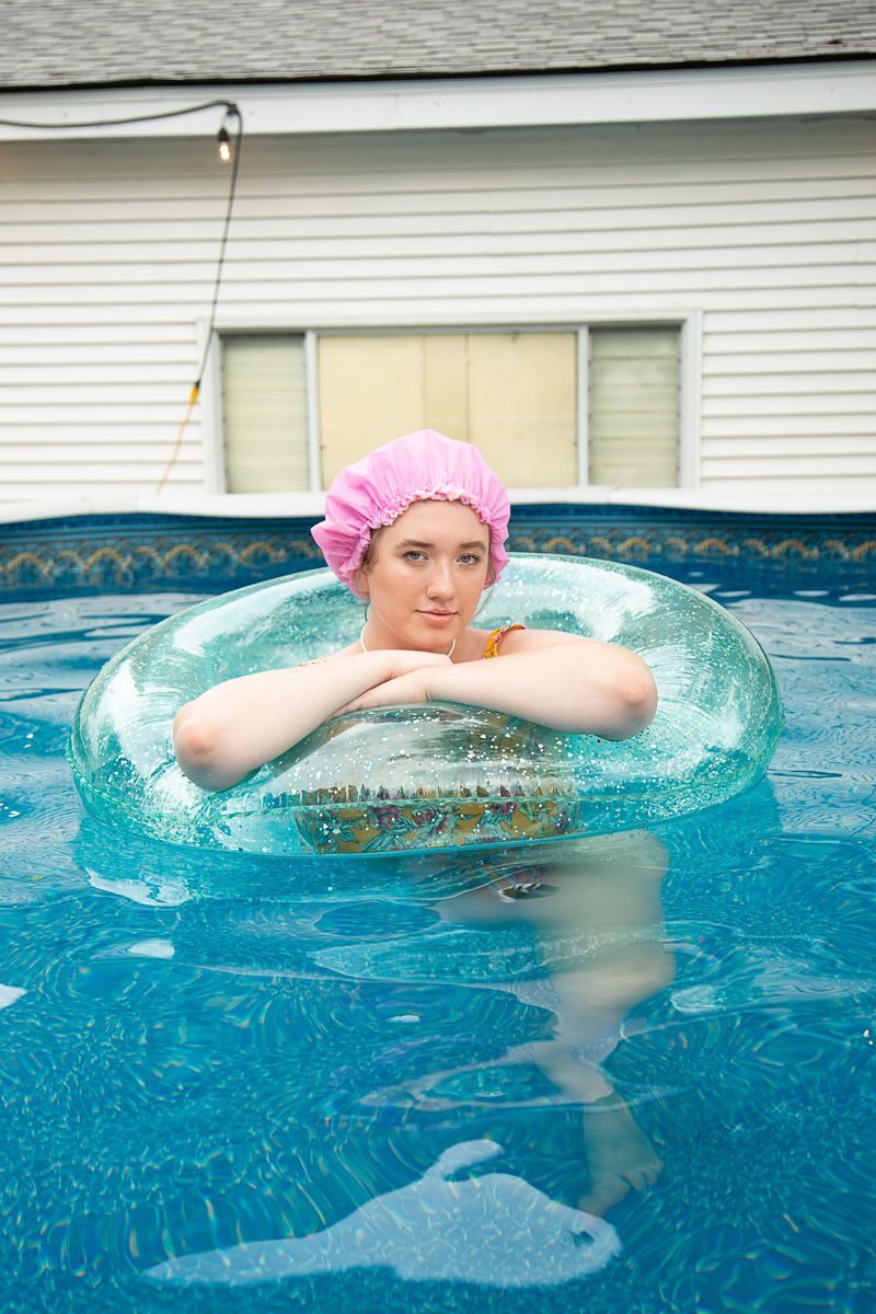 © Lindsay Morris - Ryan, a former Camp I Am camper, cools off in her urban backyard pool (2021).