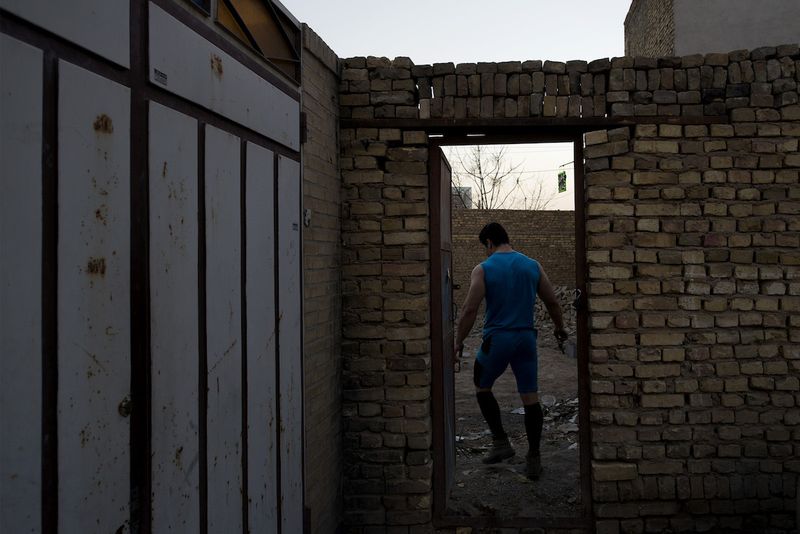 © Marjan Yazdi - Hamzeh, 32, Athlete. Hamzeh practices for a competition in the next door field that is abundant.