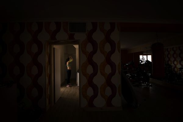 © Marjan Yazdi - Elham, 34, trainer and athlete. Elam is getting ready to start a work out before her students arrive at the gym.
