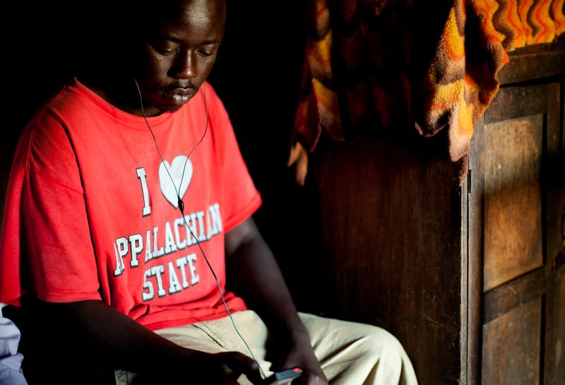 © Anne Ackermann - Listening music in his hut. There is a lot of time to kill especially for young people, the unemployment rate is very high.