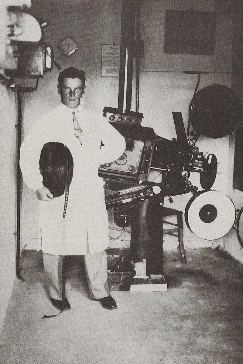 © Anne Ackermann - Portrait of my grandfather, owner of the cinema 'The Unicorn' with film rolls and film projector. Date and origin unknown.