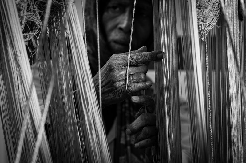 © Simone Campedelli - A portrait of creation itself: hands that tie, pull, and divide the world, one fragile thread at a time.
