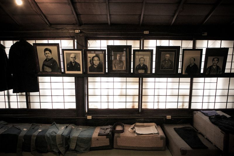© Yukari Chikura - Old pictures, hanging in an liquor store which has been open since 1856.