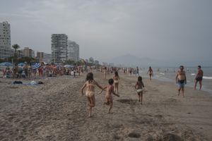 Postpandemic scenes of bathers at San Juan beach, Mediterranean sea, Alicante, Spain