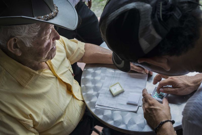 © Javier Corso - Miners, barequeros, merchants and tourists make deals everyday in the market of Muzo in search of the best emeralds.