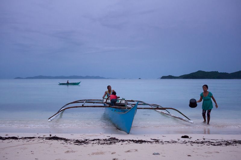 © Katherine Jack - A family returns home to Daracoton Island after a fishing trip. Palawan, 2016