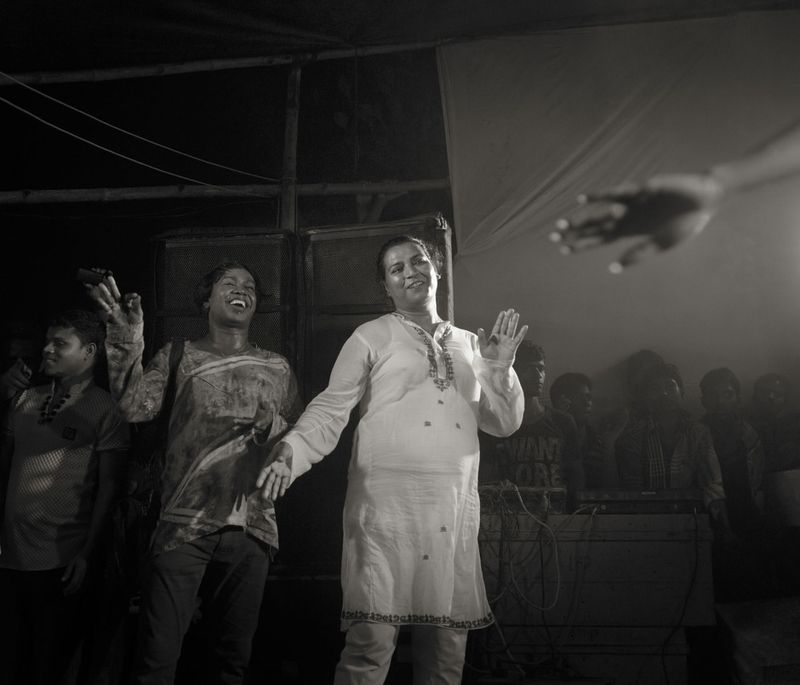 © Shahria Sharmin - Pinky Guru (56)R, leader of a Hijja community,dancing with her follower in a Puja Party. 