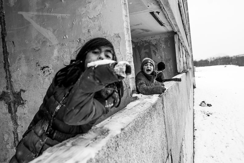 © Jana Plavec - Erika with her friends playing in one of the buildings.