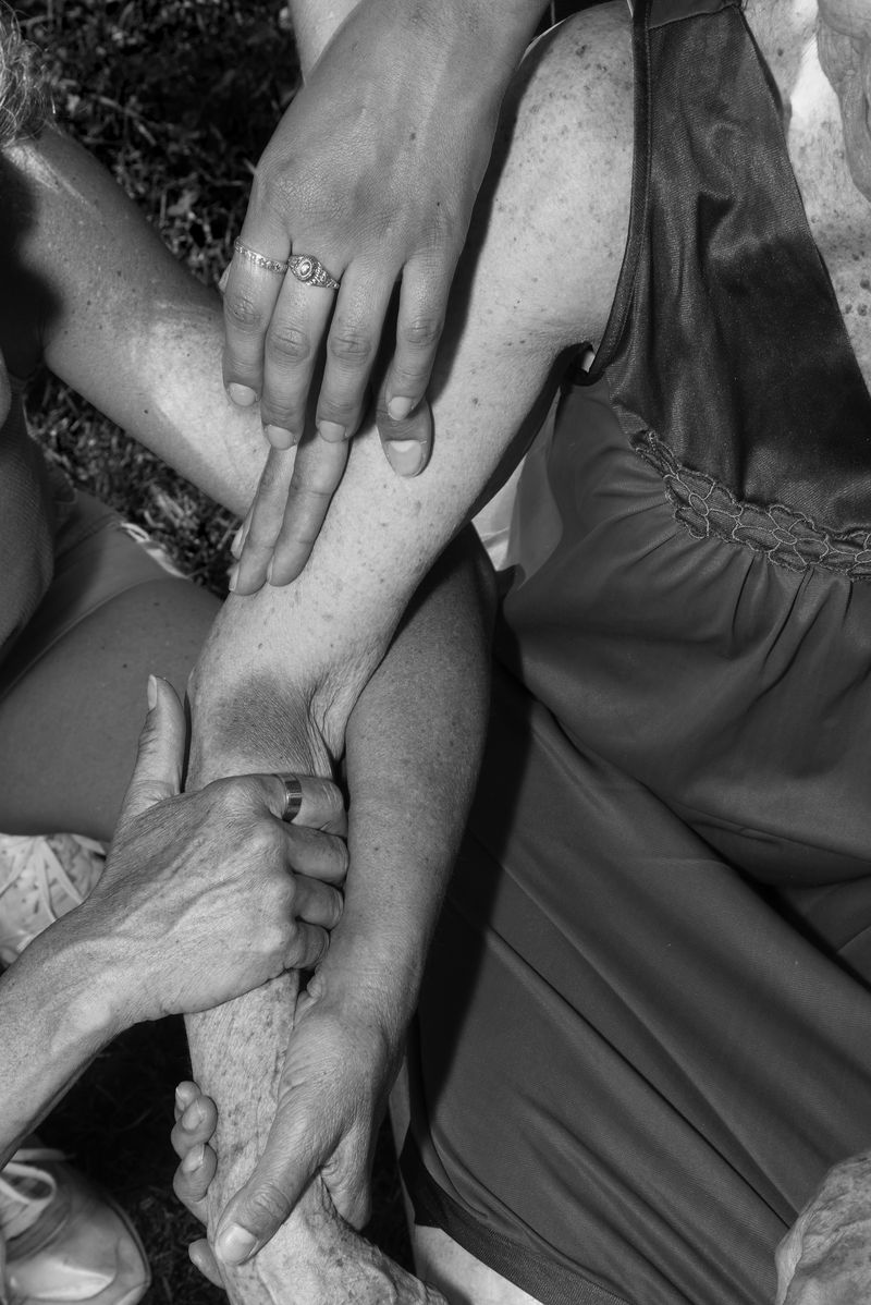 © Jillian Freyer - People lay their hands on Germaine to help her heal.