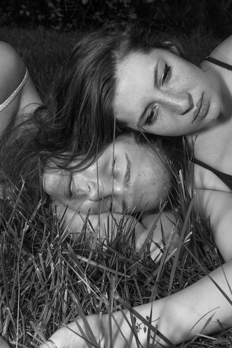 © Jillian Freyer - Sadie and Lily are lying in the grass.