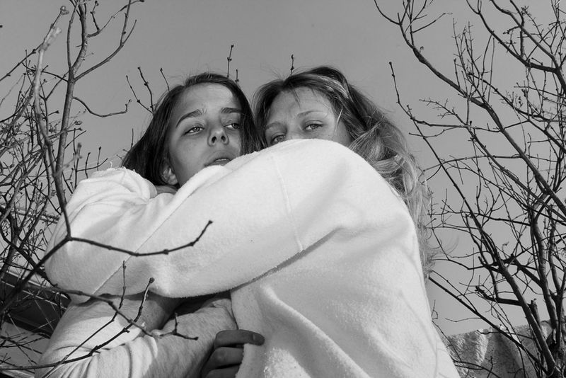 © Jillian Freyer - Chelsea and Lily embrace one another.