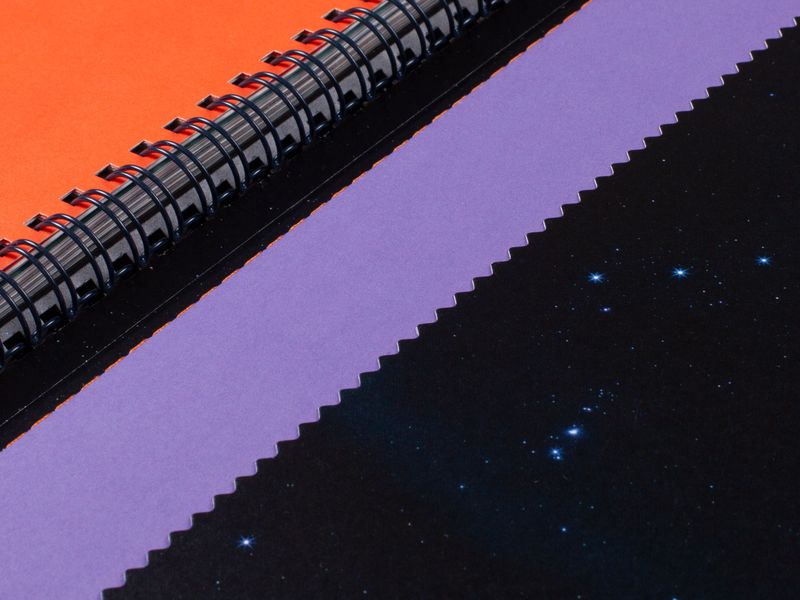 Die cut pocket in which the second booklet, The Story, is tucked into.