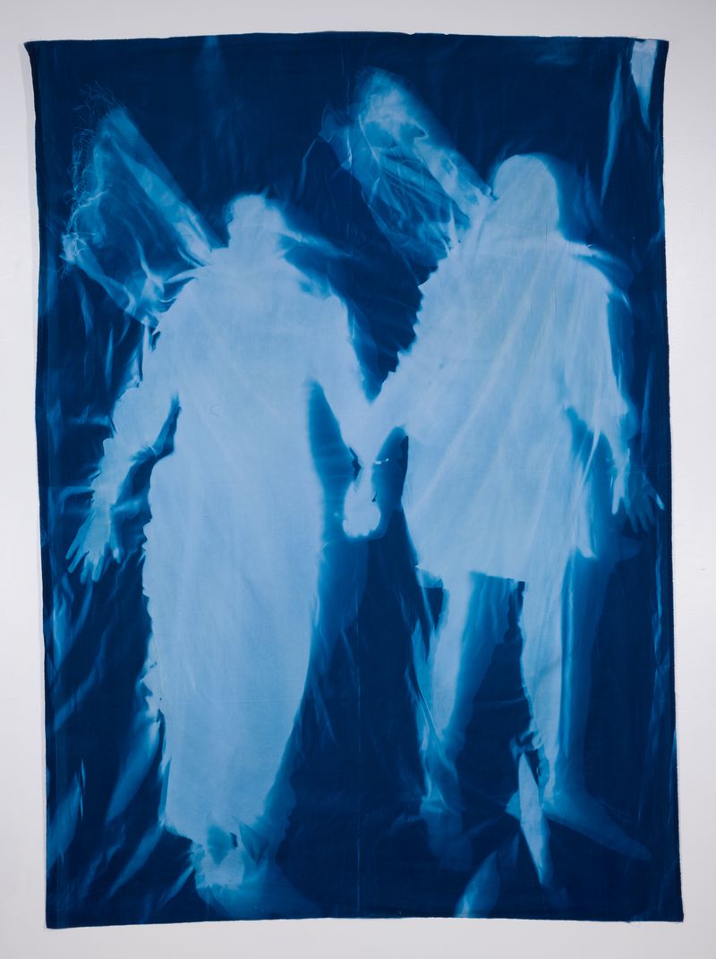 © Jackie Neale - Crossing Over: Immigration Stories, 2018 Cotton fabric cyanotype portraits 5x7ft