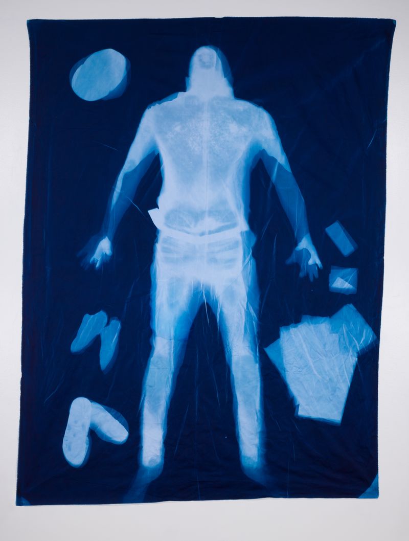 © Jackie Neale - Crossing Over: Immigration Stories, 2018 Cotton fabric cyanotype portraits 5x7ft