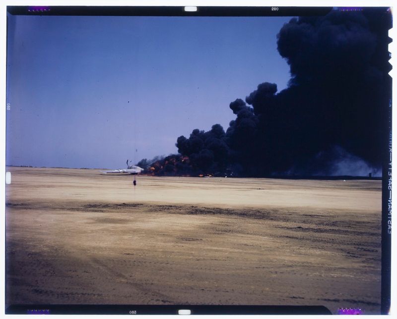 © Marianne Ingleby - A US fighter plane explodes, presumably Iwo Jima in spring of 1945.