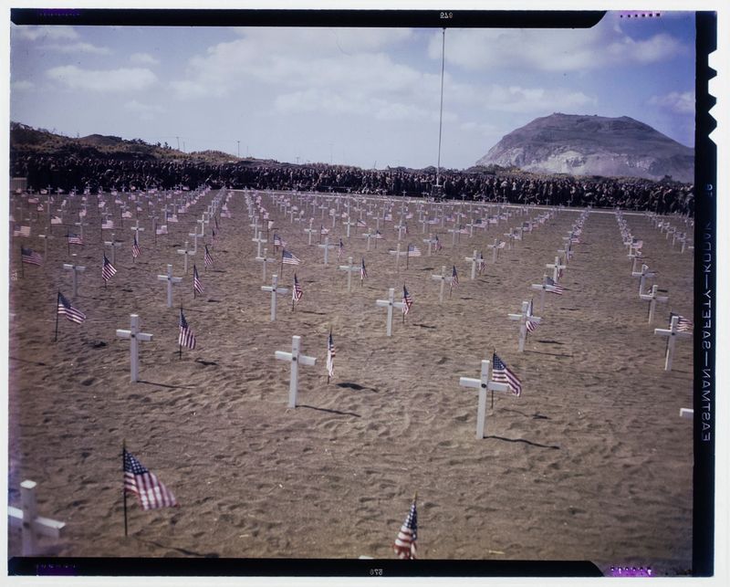 © Marianne Ingleby - Mass grave of US soldiers in spring of 1945 on Iwo Jima with Mount Suribachi in the background.