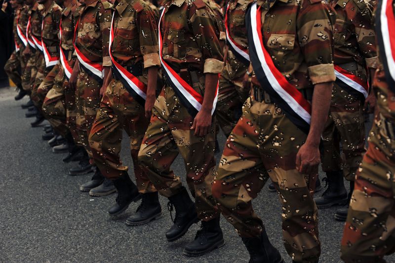 © Alex Potter - Members of the Yemeni military march in a parade to commemorate the end of the revolution.