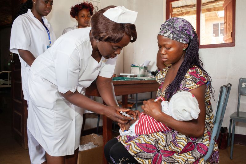 © Eleri Griffiths - St Blaise Roman Catholic community hospital, a baby receives her measles vaccine.