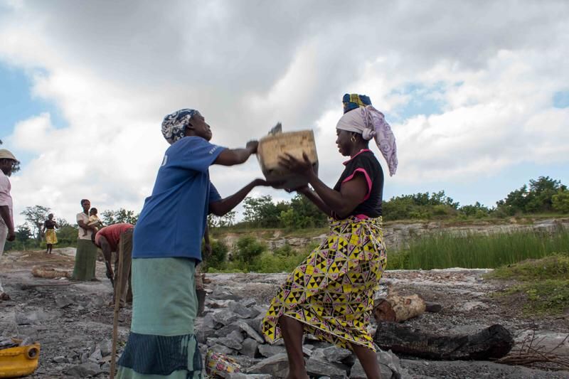 © Igho Ogbobine - Women helping each other.