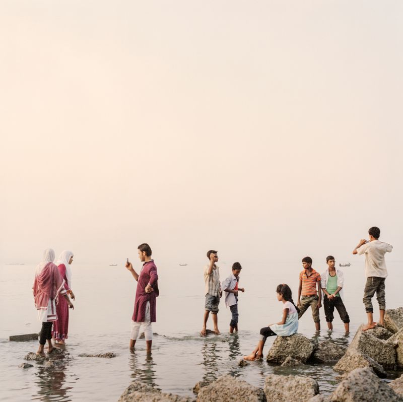 © Giulio Di Sturco - woman poses for a picture at the point of entrance to the Sunderbans in bangladesh