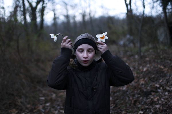 © Maddie Mcgarvey - Sonya picks wildflowers on a long walk.