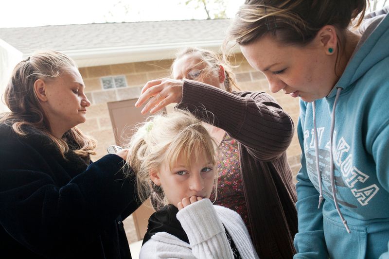 © Maddie Mcgarvey - Sonya's mother, grandmother and Aunt try to fix her hair and dress while competing in a beauty pageant in Athens, OH.
