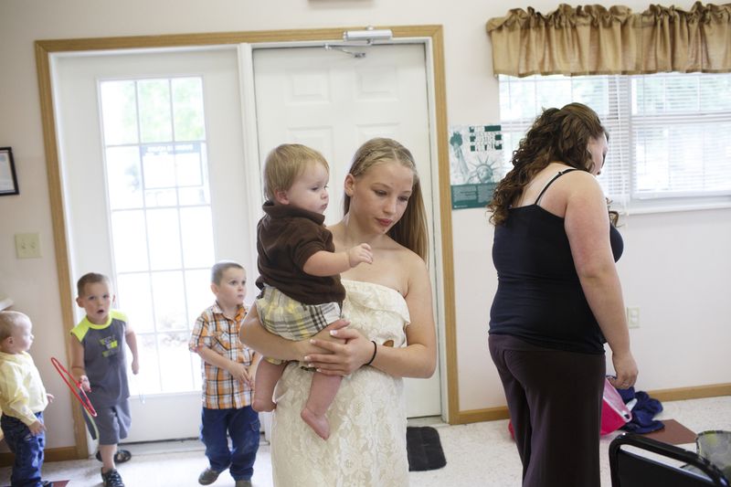 © Maddie Mcgarvey - Sonya carries around her cousin before her aunt's wedding.