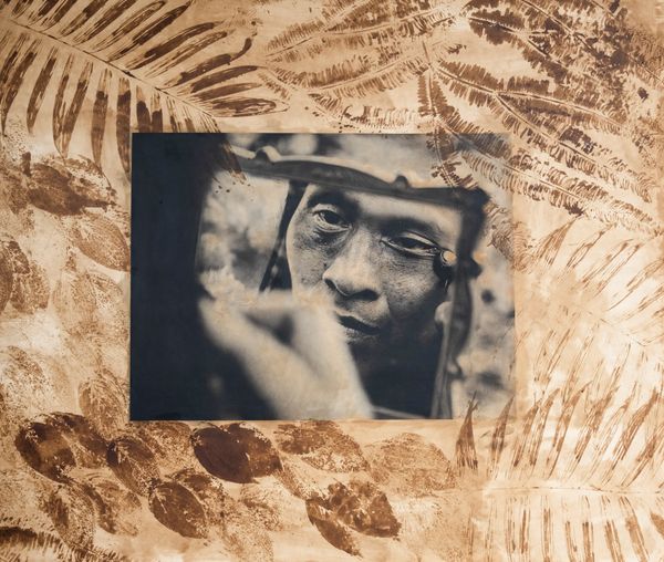 © Felipe Jacome - Carmen puts on achiote pigment across her eyes, the traditional face paint of the Waorani.