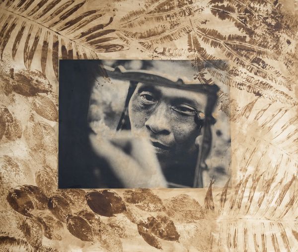 © Felipe Jacome - Carmen puts on achiote pigment across her eyes, the traditional face paint of the Waorani.