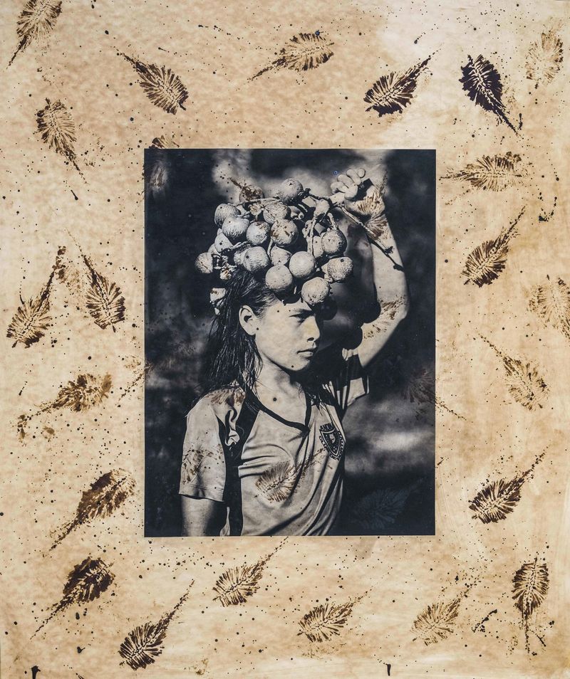 © Felipe Jacome - Isabel carries a bushel of chonta, a coveted fruit that grows on chonta palm trees only once a year.