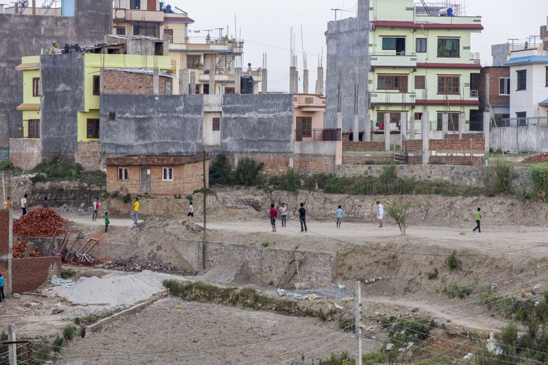 © Heidi Wentworth-Ping - Former street children play football with other local children near their NGO run home in a quiet part of Kathmandu.