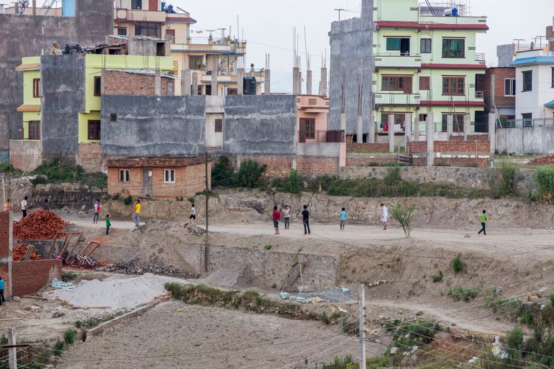 © Heidi Wentworth-Ping - Former street children play football with other local children near their NGO run home in a quiet part of Kathmandu.