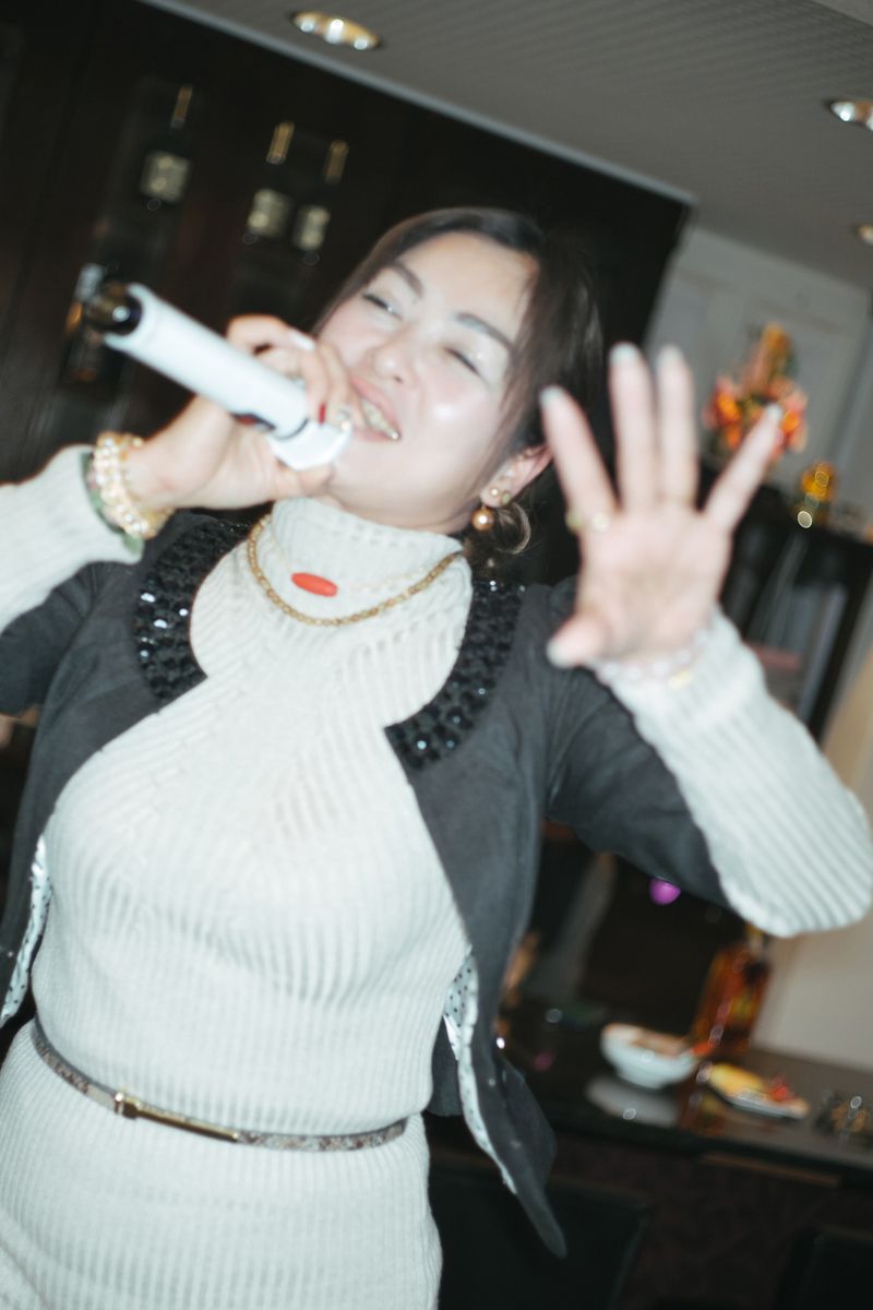 © Kenta Nakamura - At karaoke snack bar.