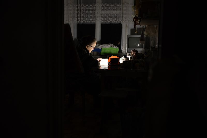 © Sofia Samoylova - Serafima after Jevhen’s death2026Serafima is reading a book; there is a blackout, no electricity, only flashlights.