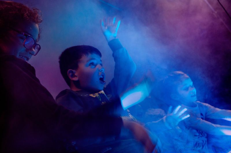 © Clelia Carbonari - Some kids under the stage are dancing at the music of the Sunday mass.