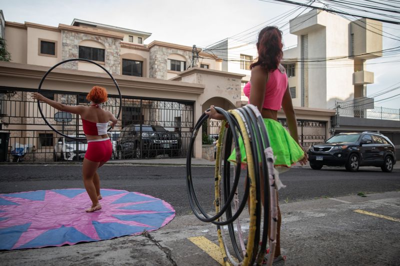 © Tomas Ayuso - In full costume, they hoped to raise enough cash to allow them to travel home to Guatemala.